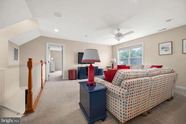 carpeted living room featuring lofted ceiling and ceiling fan