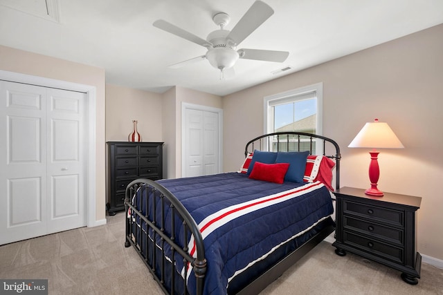 bedroom with light colored carpet and ceiling fan