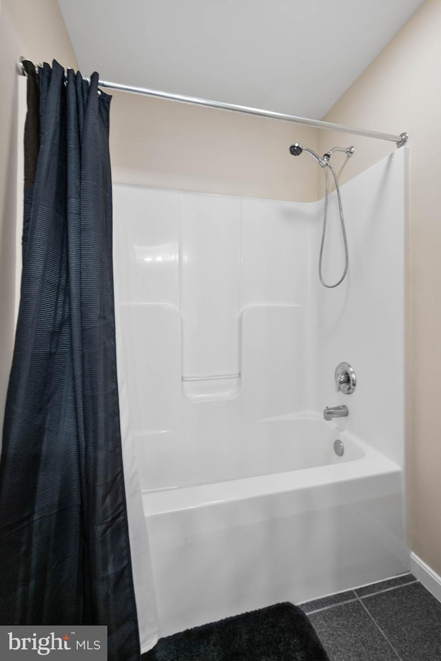 bathroom featuring shower / tub combo and tile patterned floors