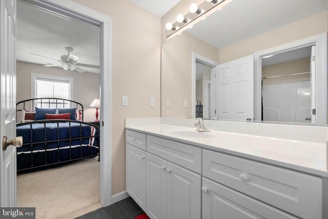 bathroom featuring vanity, ceiling fan, and walk in shower