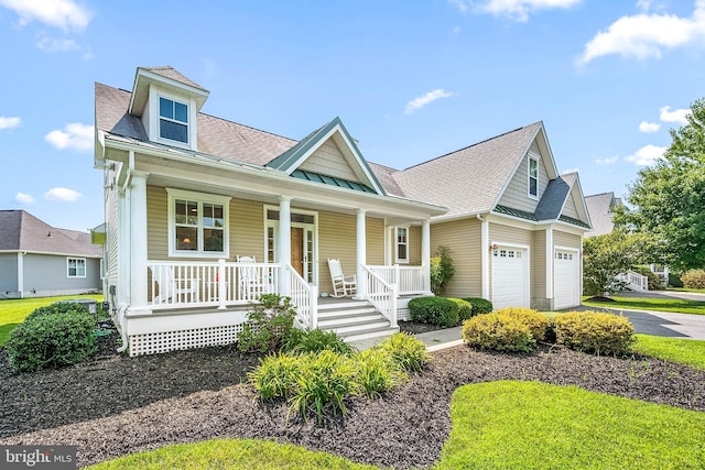 view of front of house with a porch and a garage