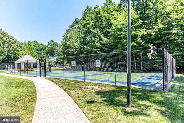 view of home's community featuring basketball court, tennis court, and a lawn