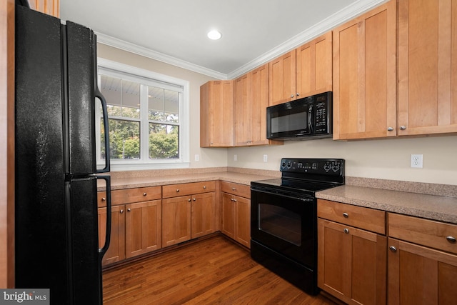 kitchen with ornamental molding, dark hardwood / wood-style floors, and black appliances