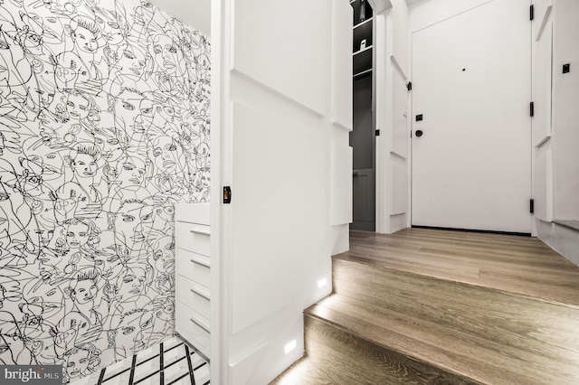 stairs with wood-type flooring