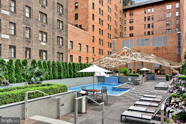 view of pool with pool water feature