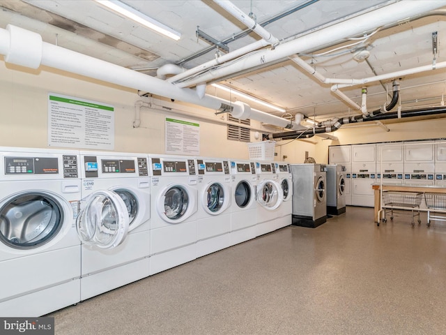 clothes washing area featuring independent washer and dryer