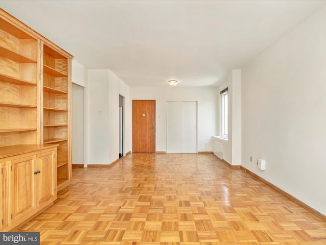 unfurnished room featuring light parquet floors