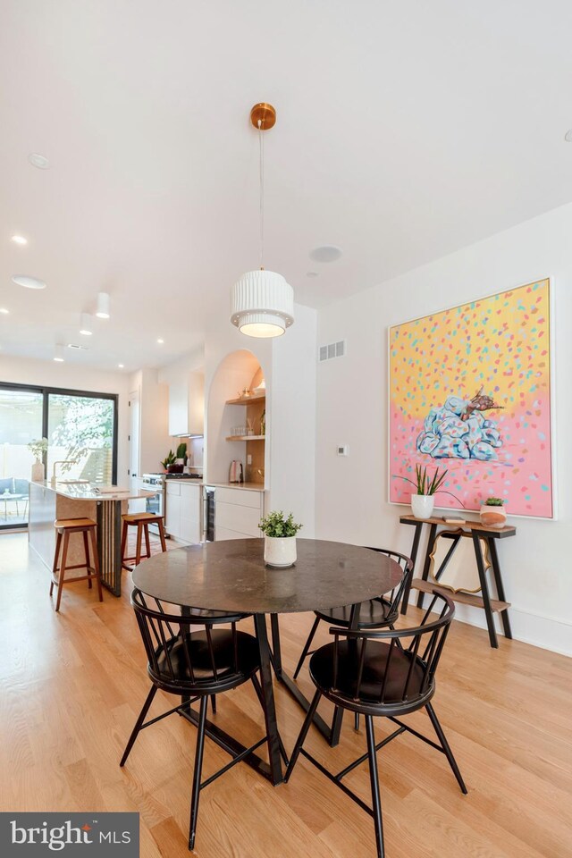 interior space with bar area and wine cooler