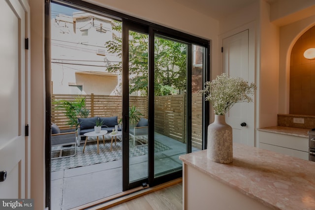 doorway to outside featuring light hardwood / wood-style flooring