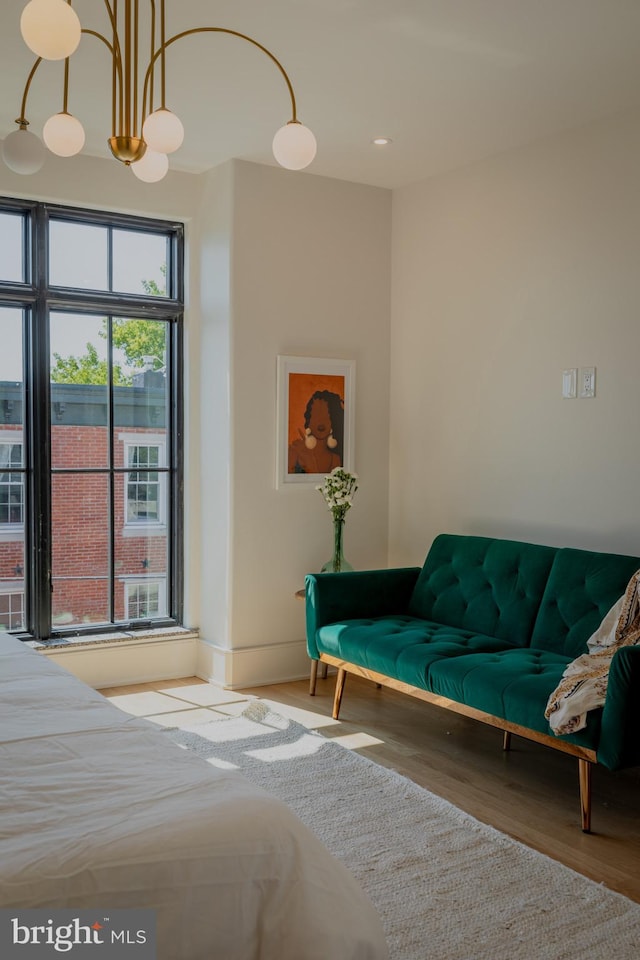 interior space with a chandelier and hardwood / wood-style flooring