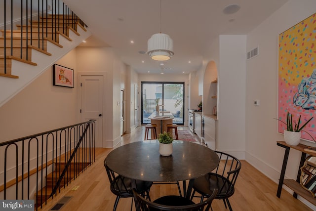 dining area with light hardwood / wood-style floors