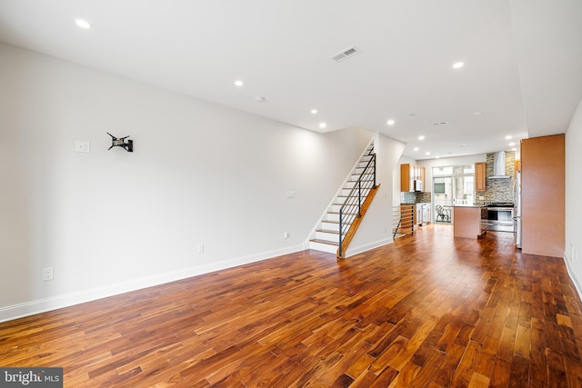 unfurnished living room with hardwood / wood-style flooring