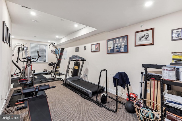 exercise room featuring carpet flooring