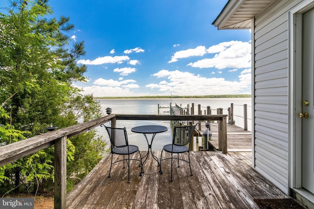 wooden terrace with a water view