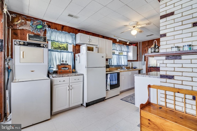 kitchen featuring plenty of natural light, ceiling fan, white appliances, and white cabinetry