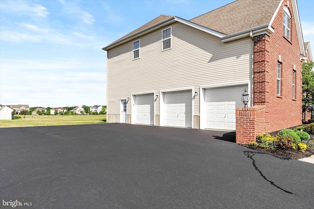 view of property exterior featuring a garage