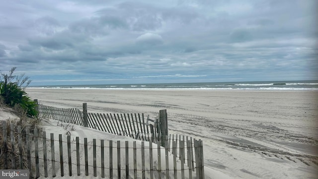 view of home's community with a view of the beach and a water view