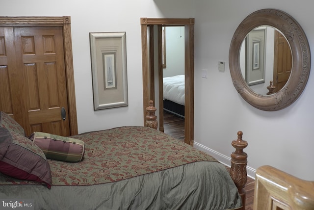 bedroom with wood-type flooring