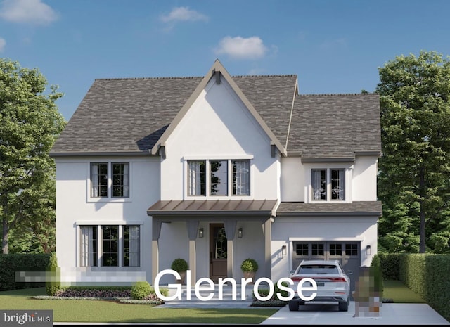 view of front of house featuring a front yard and a garage