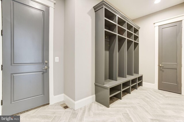 interior space with beverage cooler, a healthy amount of sunlight, and light hardwood / wood-style floors