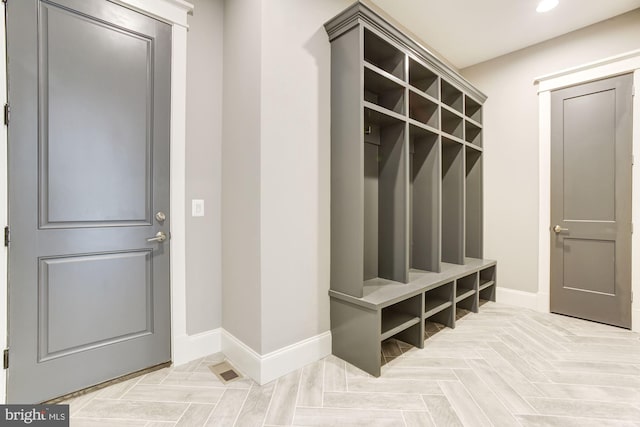 mudroom featuring light parquet flooring