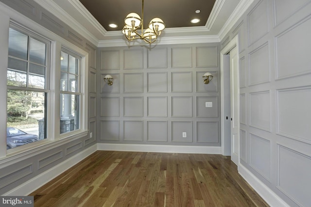 unfurnished dining area with dark wood-type flooring and a chandelier