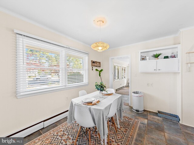 dining room featuring crown molding and a baseboard radiator