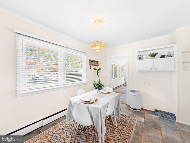 dining area featuring crown molding and baseboard heating