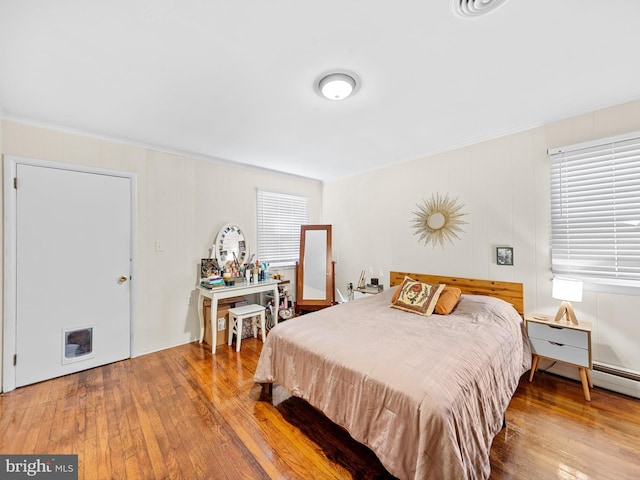 bedroom with wood-type flooring