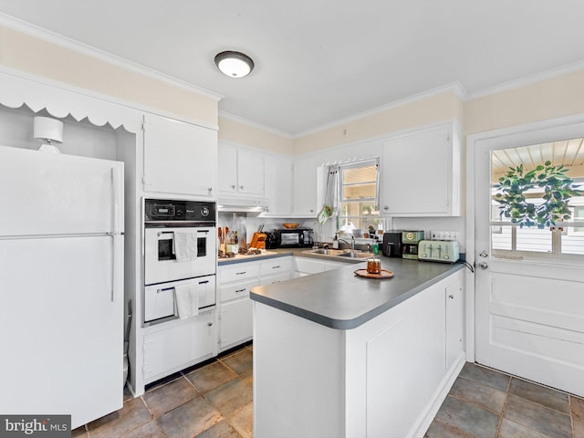 kitchen with white cabinets, white appliances, sink, and ornamental molding