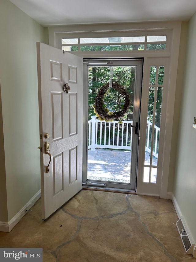 entrance foyer featuring plenty of natural light