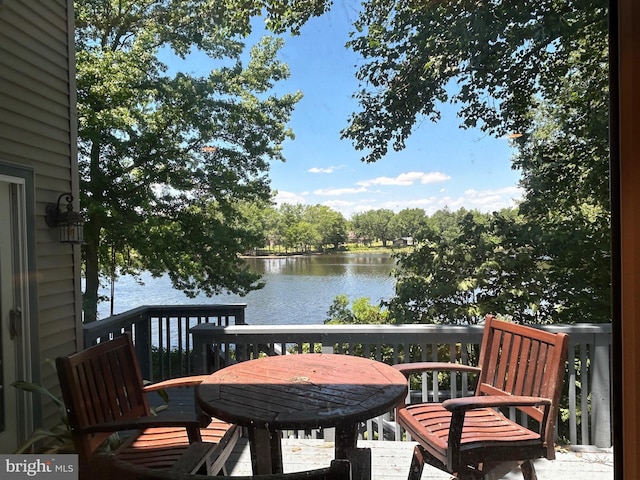 deck featuring a water view