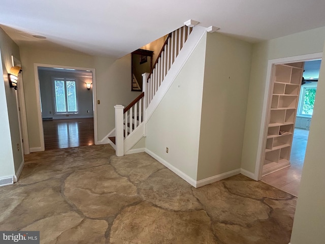 staircase with wood-type flooring