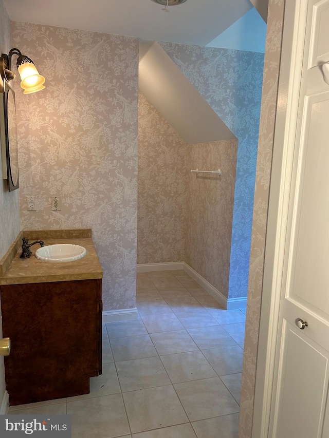 bathroom featuring tile patterned flooring and vanity