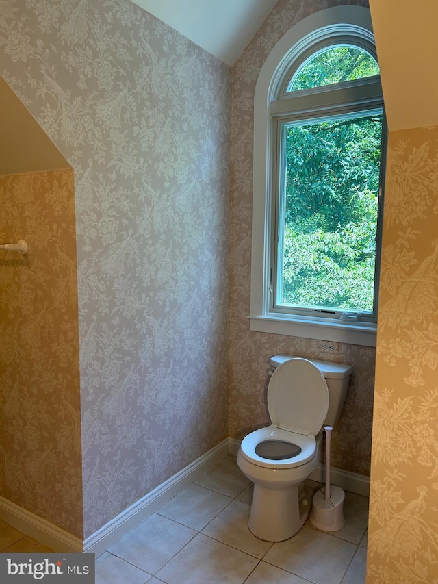 bathroom with tile patterned floors and toilet