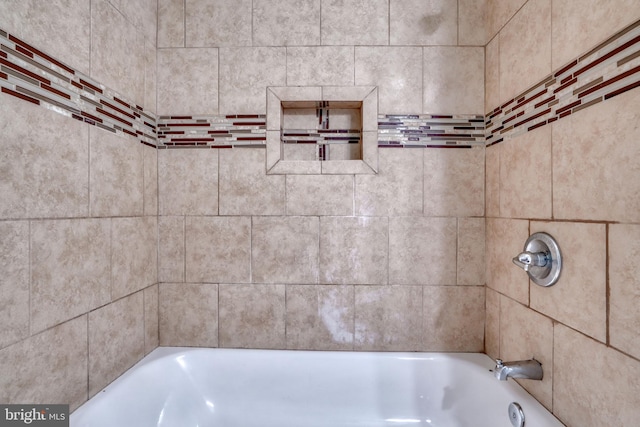 bathroom with a washtub