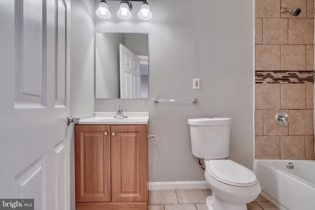 full bathroom with toilet, vanity, tile patterned floors, and tiled shower / bath combo