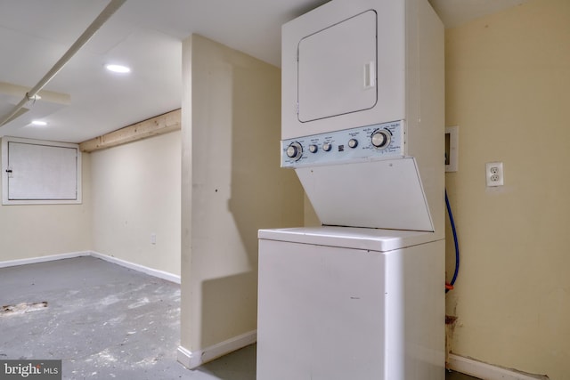 laundry area with stacked washer / dryer