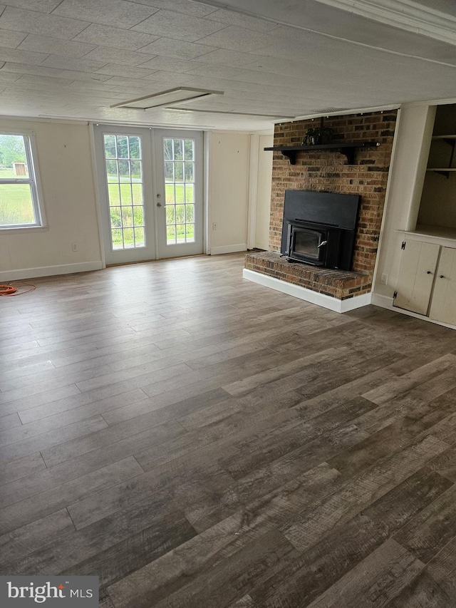 unfurnished living room featuring french doors and hardwood / wood-style flooring