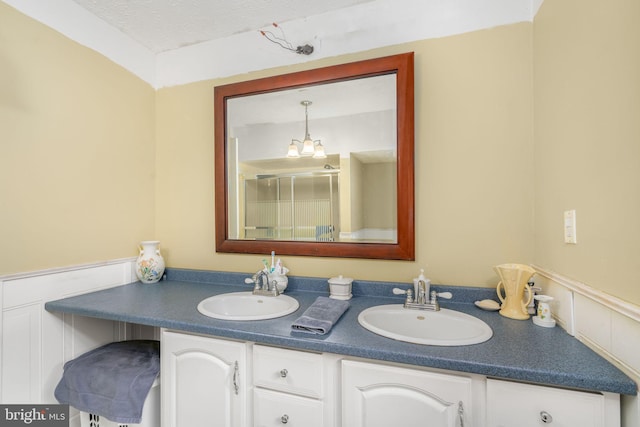 bathroom featuring vanity and a textured ceiling