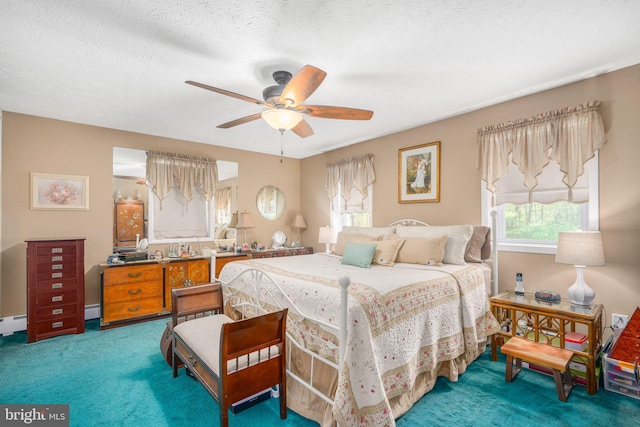 bedroom with carpet, ceiling fan, and a textured ceiling