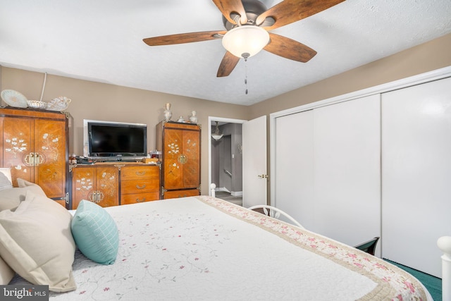 bedroom with carpet, ceiling fan, and a closet