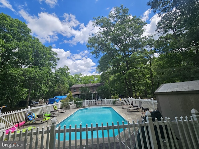 view of swimming pool featuring a patio