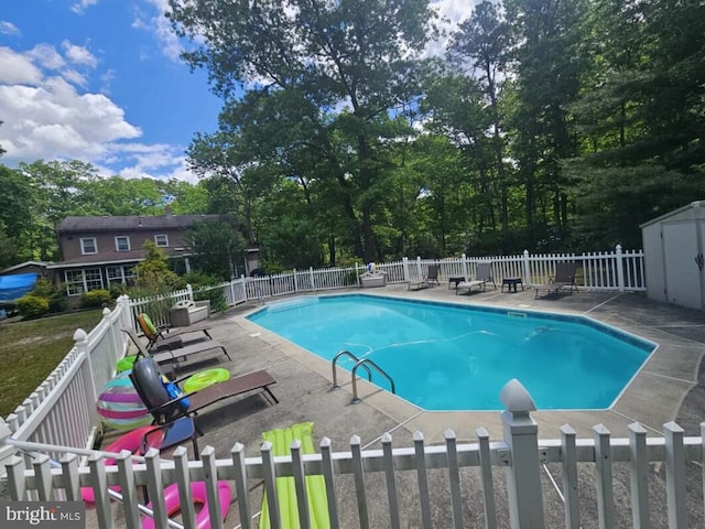 view of swimming pool with a patio