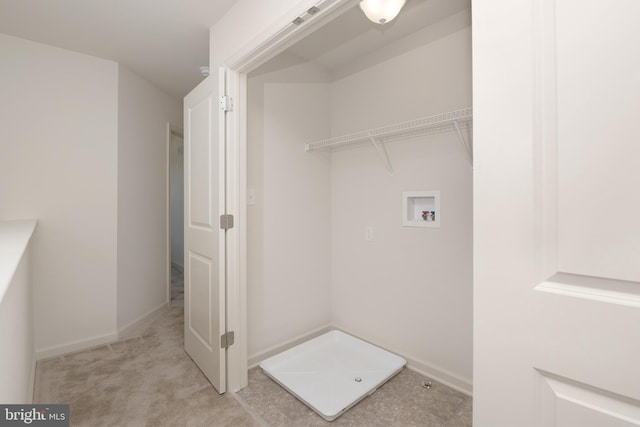 clothes washing area with washer hookup and light colored carpet