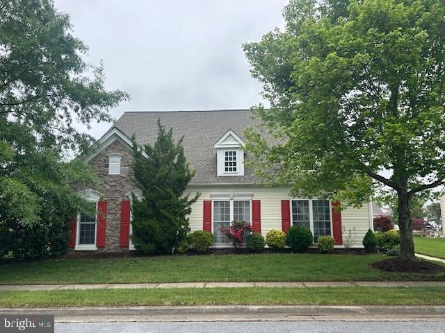 view of front of home with a front yard