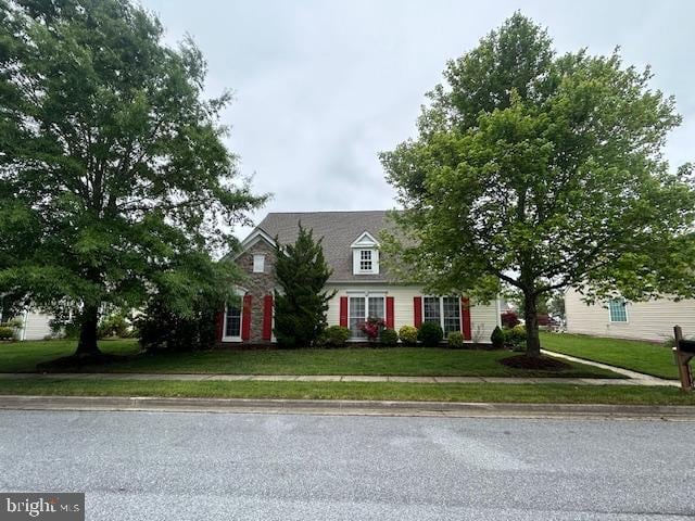 view of front of home with a front lawn