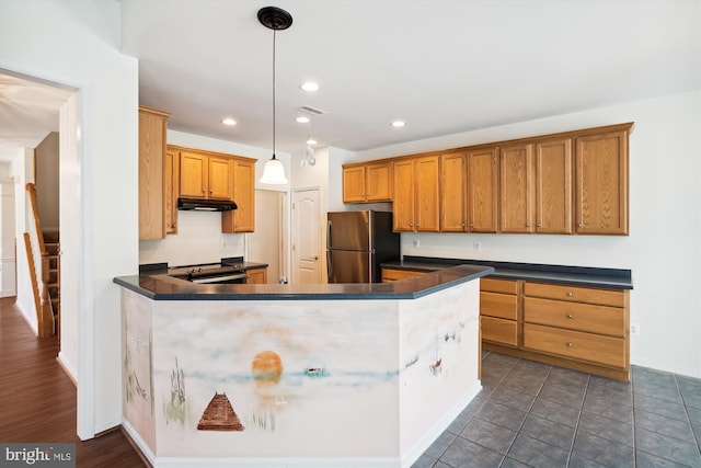 kitchen with kitchen peninsula, stainless steel fridge, dark hardwood / wood-style floors, and pendant lighting