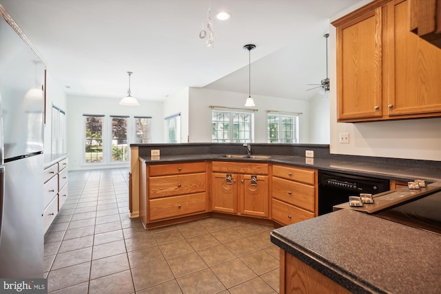 kitchen featuring kitchen peninsula, vaulted ceiling, ceiling fan, sink, and black appliances