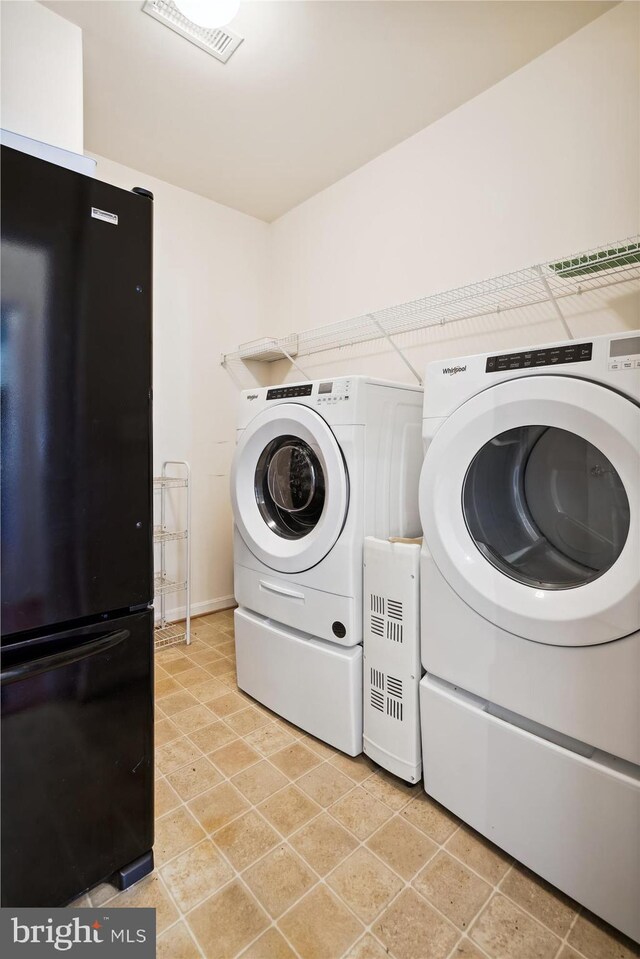 laundry area with independent washer and dryer